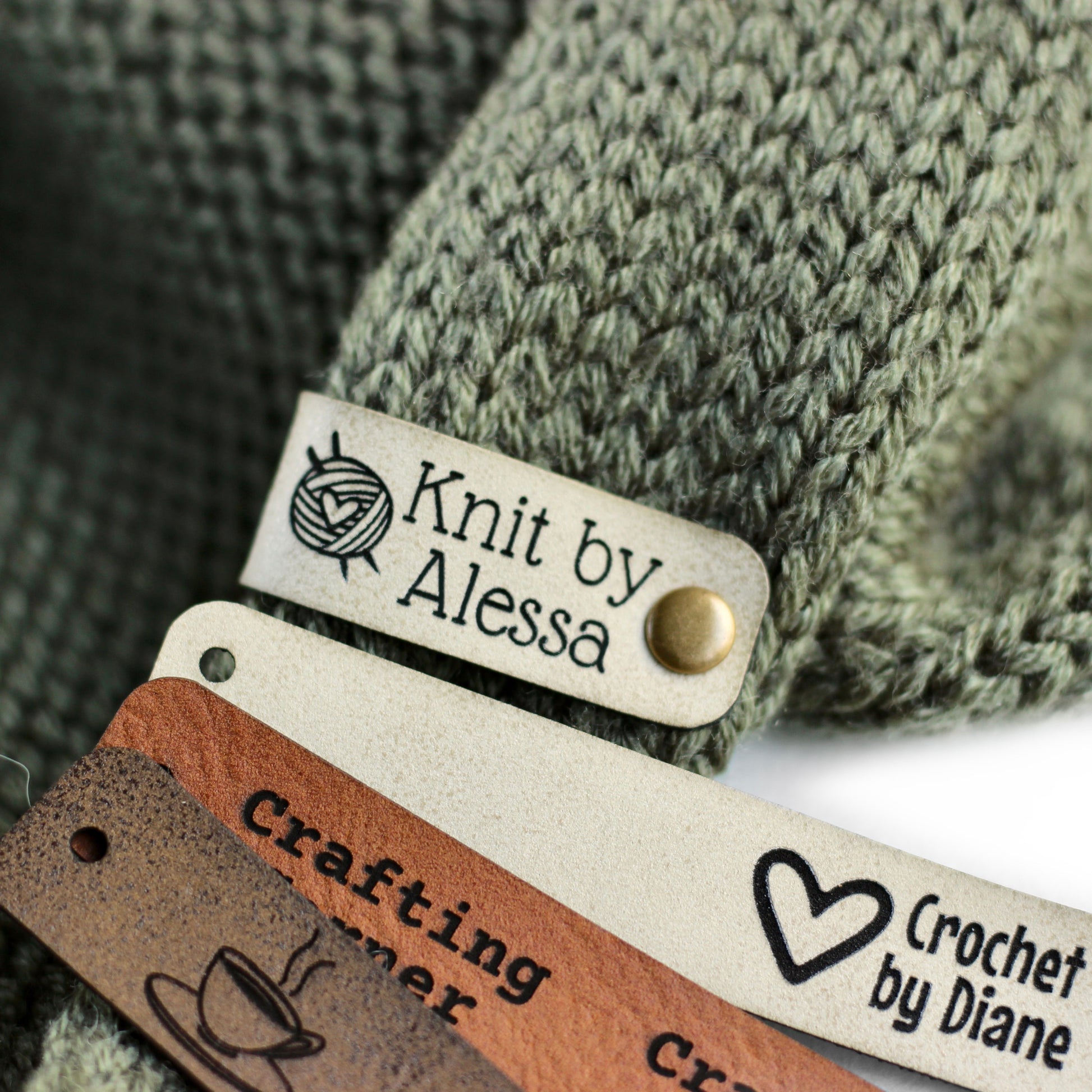 Leather label with logo in ivory for knitting.