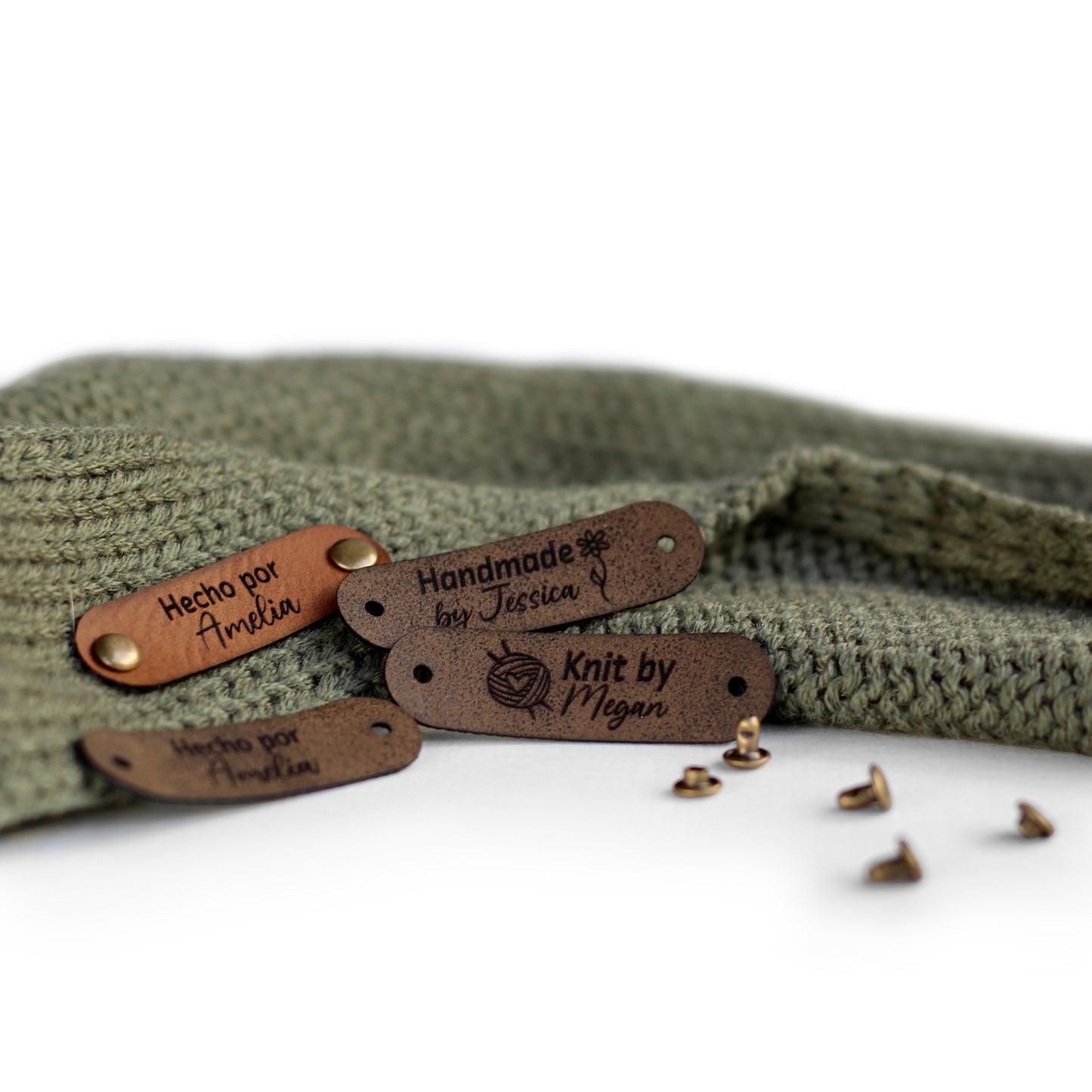 Brown color tags for knitting, perfect for customization, attached with rivets on both ends.