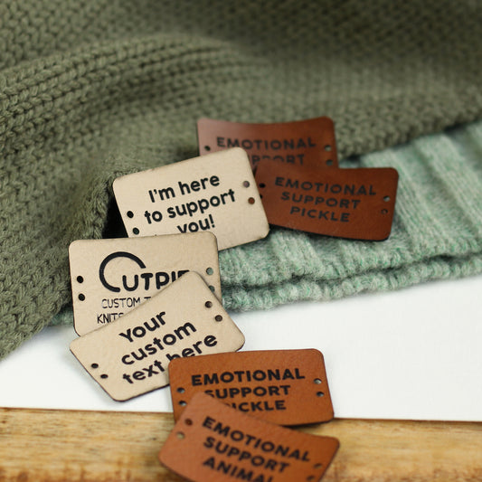 Close-up of faux leather tag on Emotional Support Chicken
