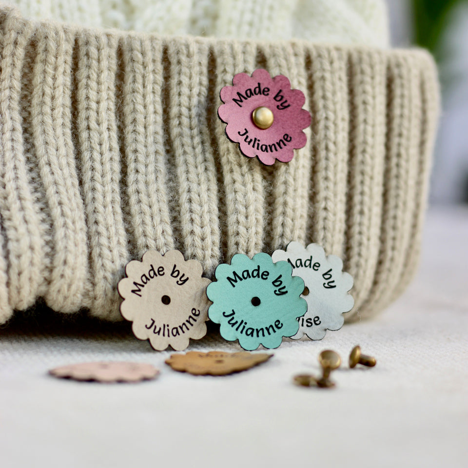 Colorful buttons with 'Made by Julianne' text on a textured surface