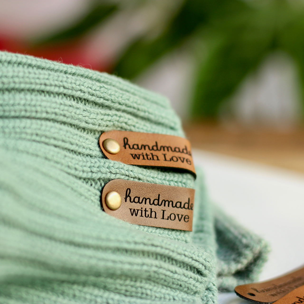 Handmade with Love tags attached to a Beanie with Rivet Snaps