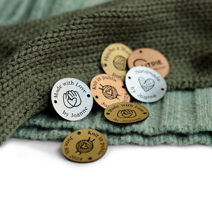 Collection of round custom name or logo tags in copper, gold, and silver