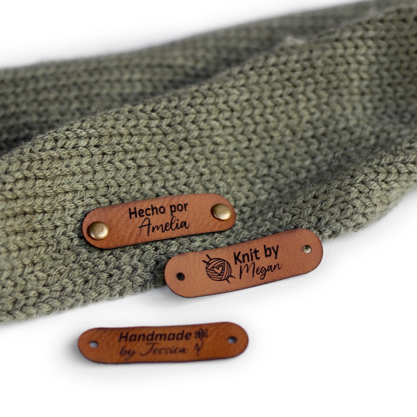 Brick color tags for knitting, perfect for customization, attached with rivets on both ends.