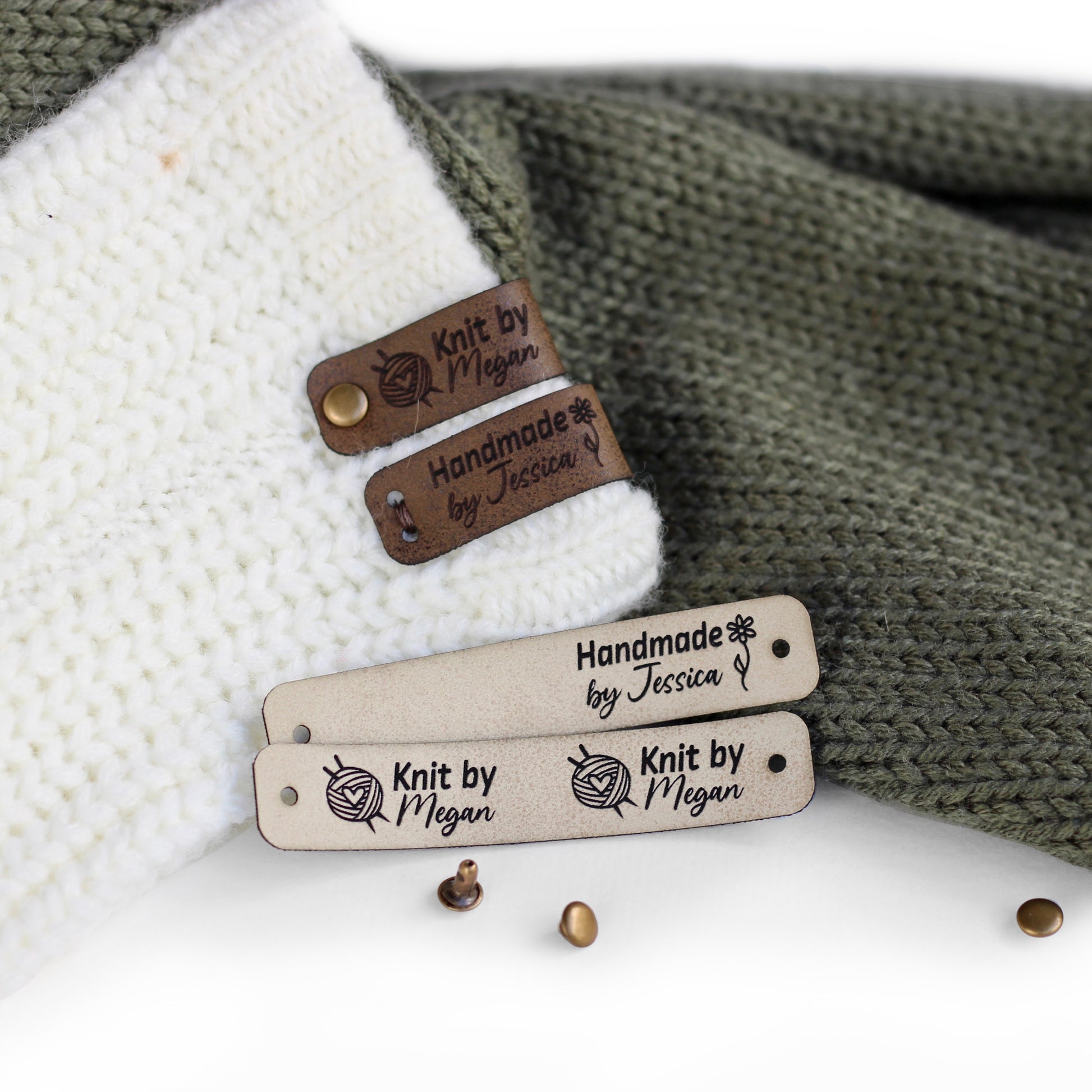 Folded tags attached to a knitted fabric with bronze rivets in ivory faux leather