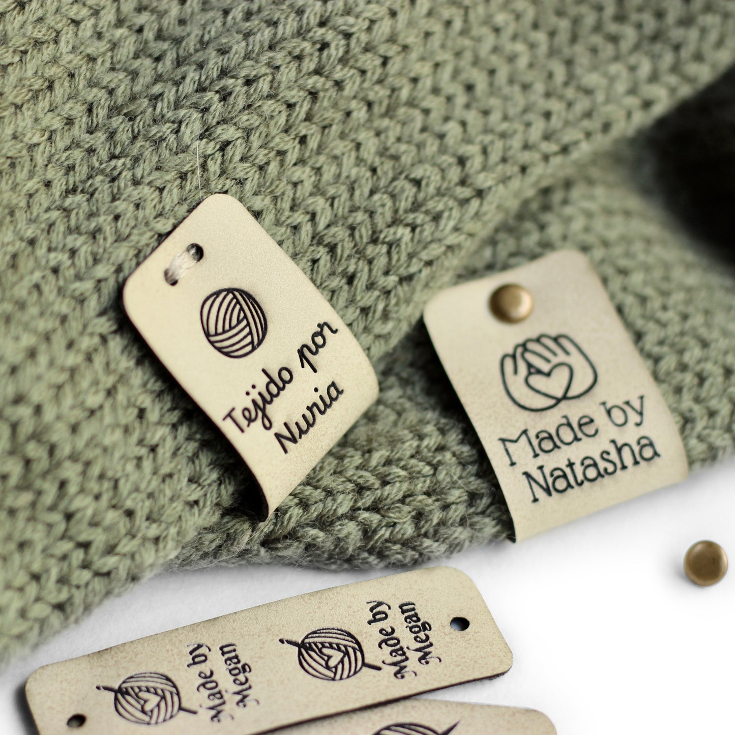 Knitting labels in an off white shade.