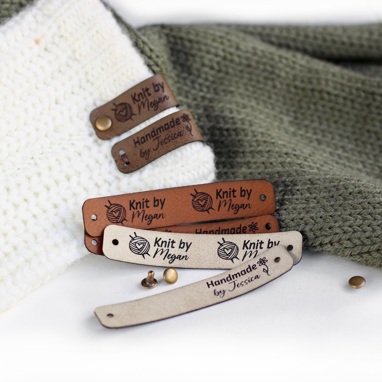 Folded tags attached to a knitted fabric with bronze rivets in several faux leather shades of brown